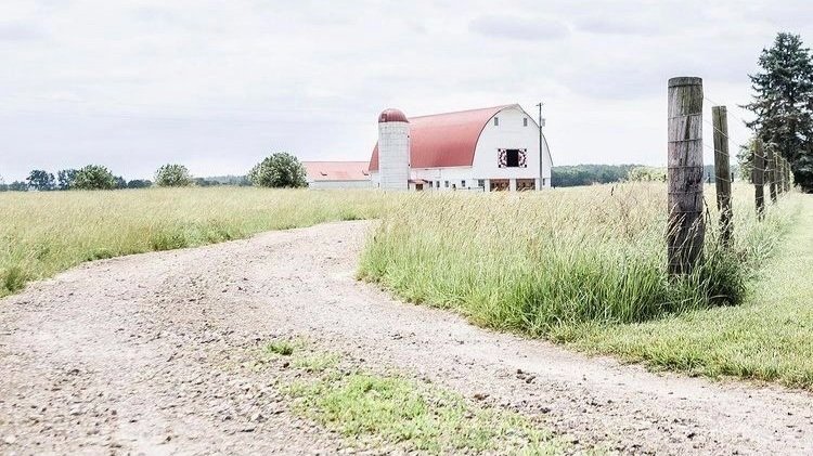Sunlit farmhouse bridal suite with vintage details